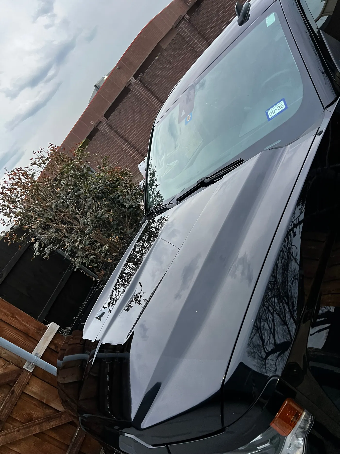Chevy Silverado hood reflection under stormy sky