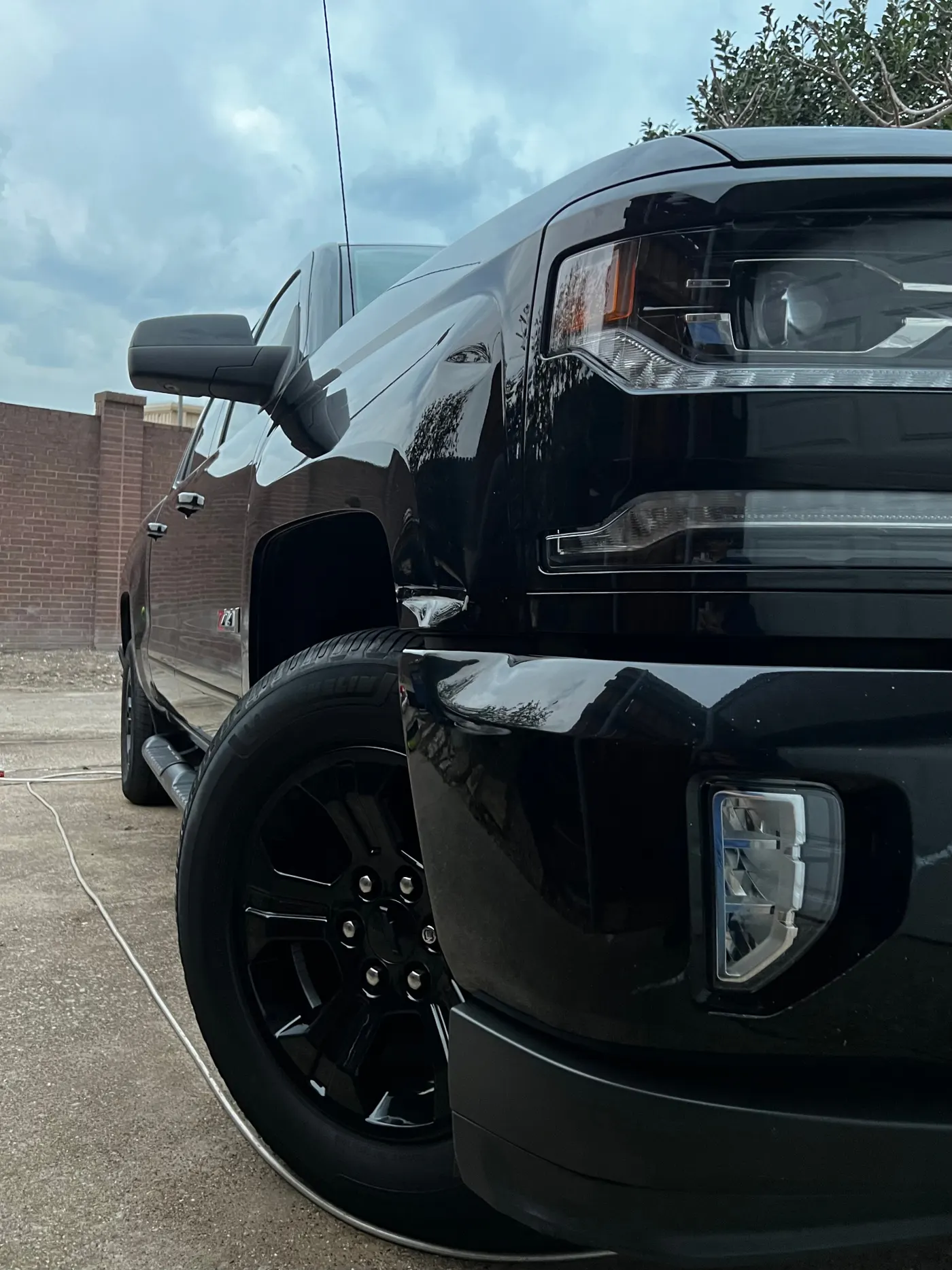 Chevy Silverado front quarter with dark gloss reflections
