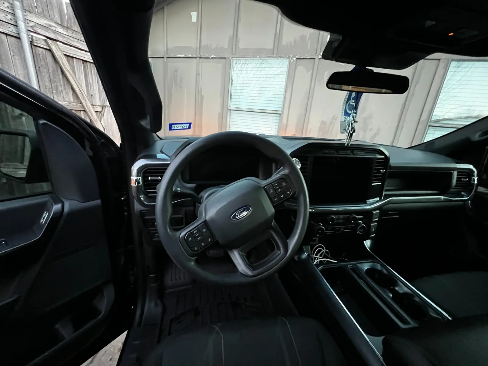 Clean dashboard and steering wheel of the Ford F-150 after detailing
