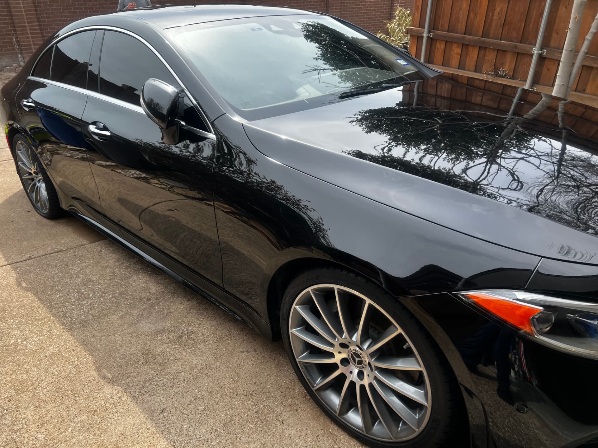 Clean, glossy black paint and polished wheel on the Mercedes-Benz CLS 450