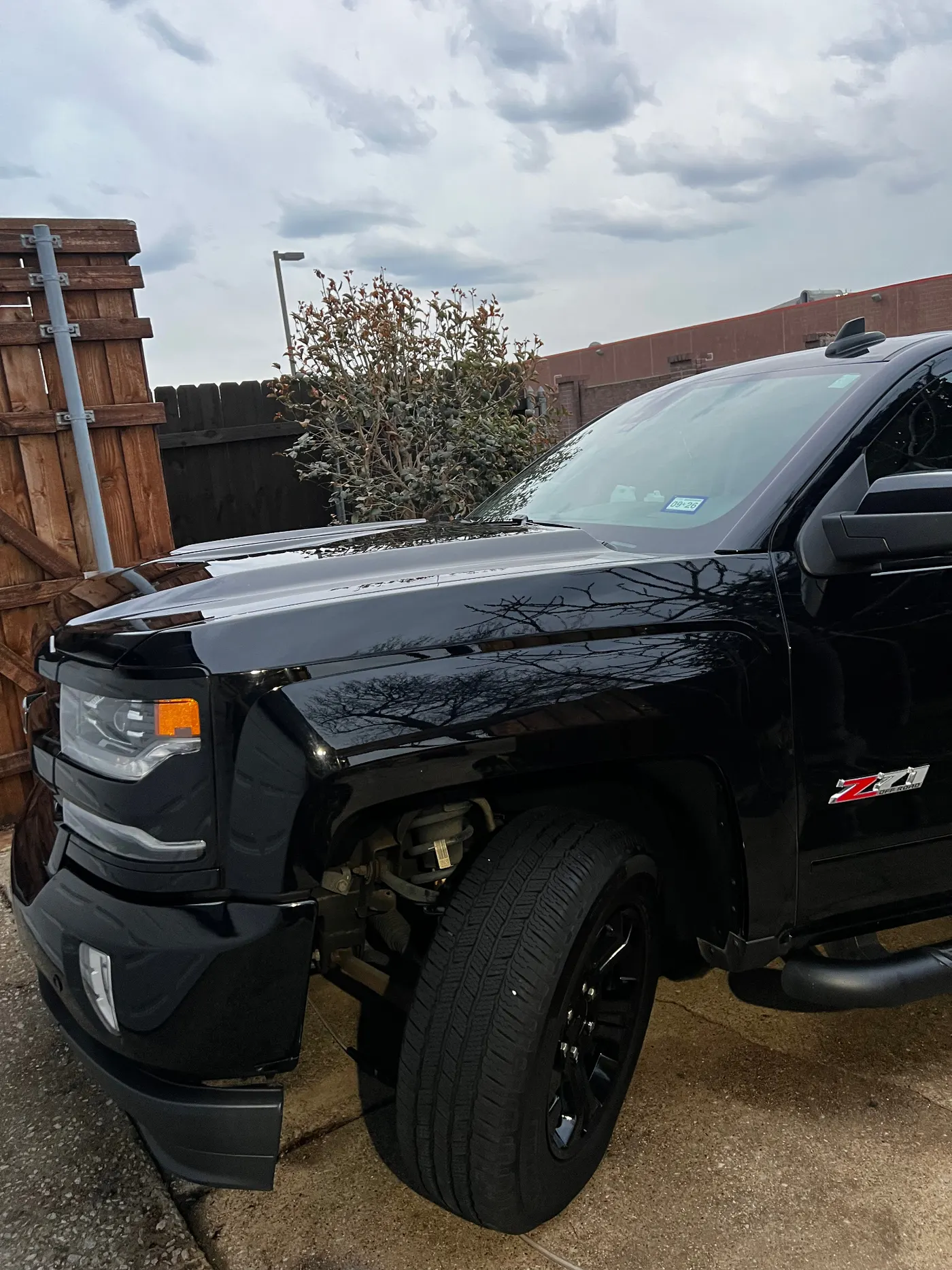 Chevy Silverado Z71 blacked-out front quarter with mirror gloss