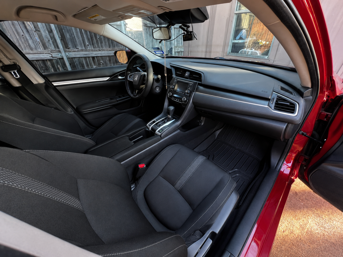 Clean front cabin, dashboard and seats of the Honda Civic after detailing