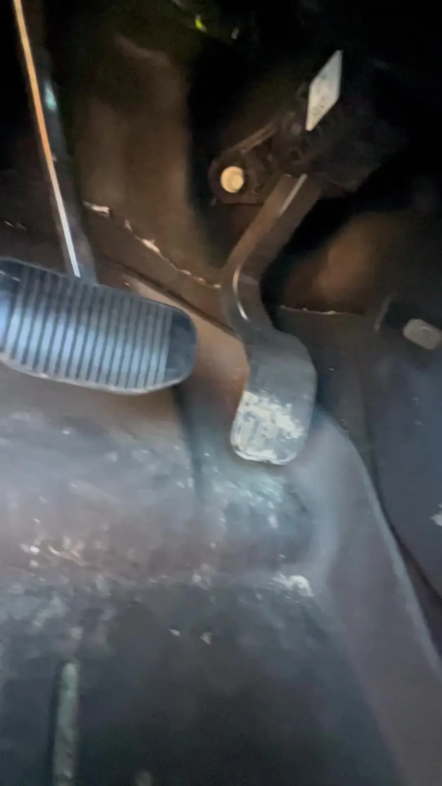 Dirt and debris around the pedals of the Ford F-150 before cleaning