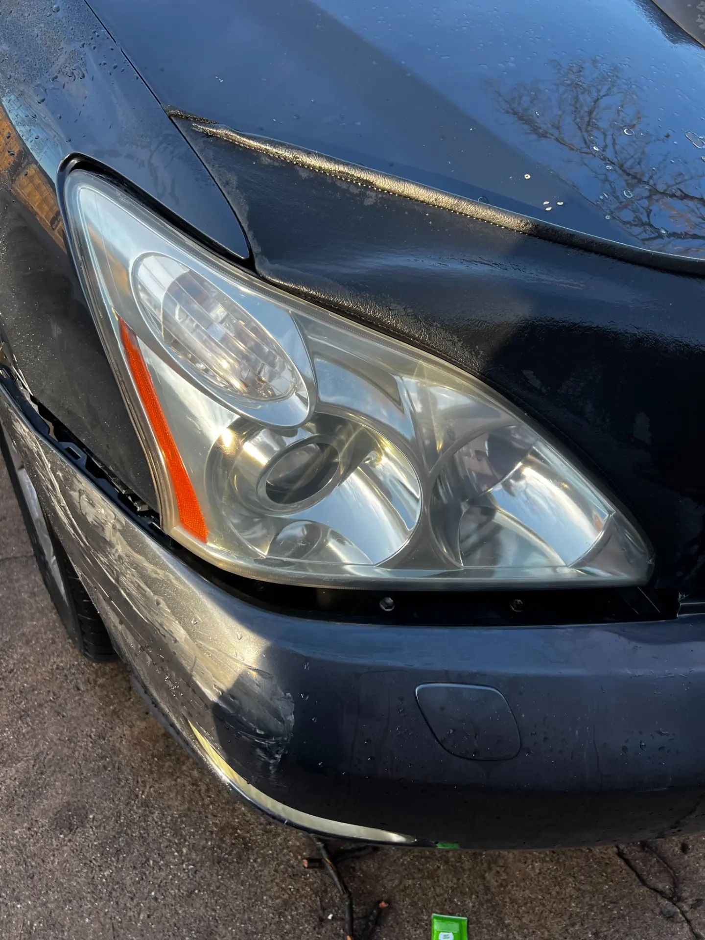 Close-up of the restored, clear Lexus RX headlight after polishing