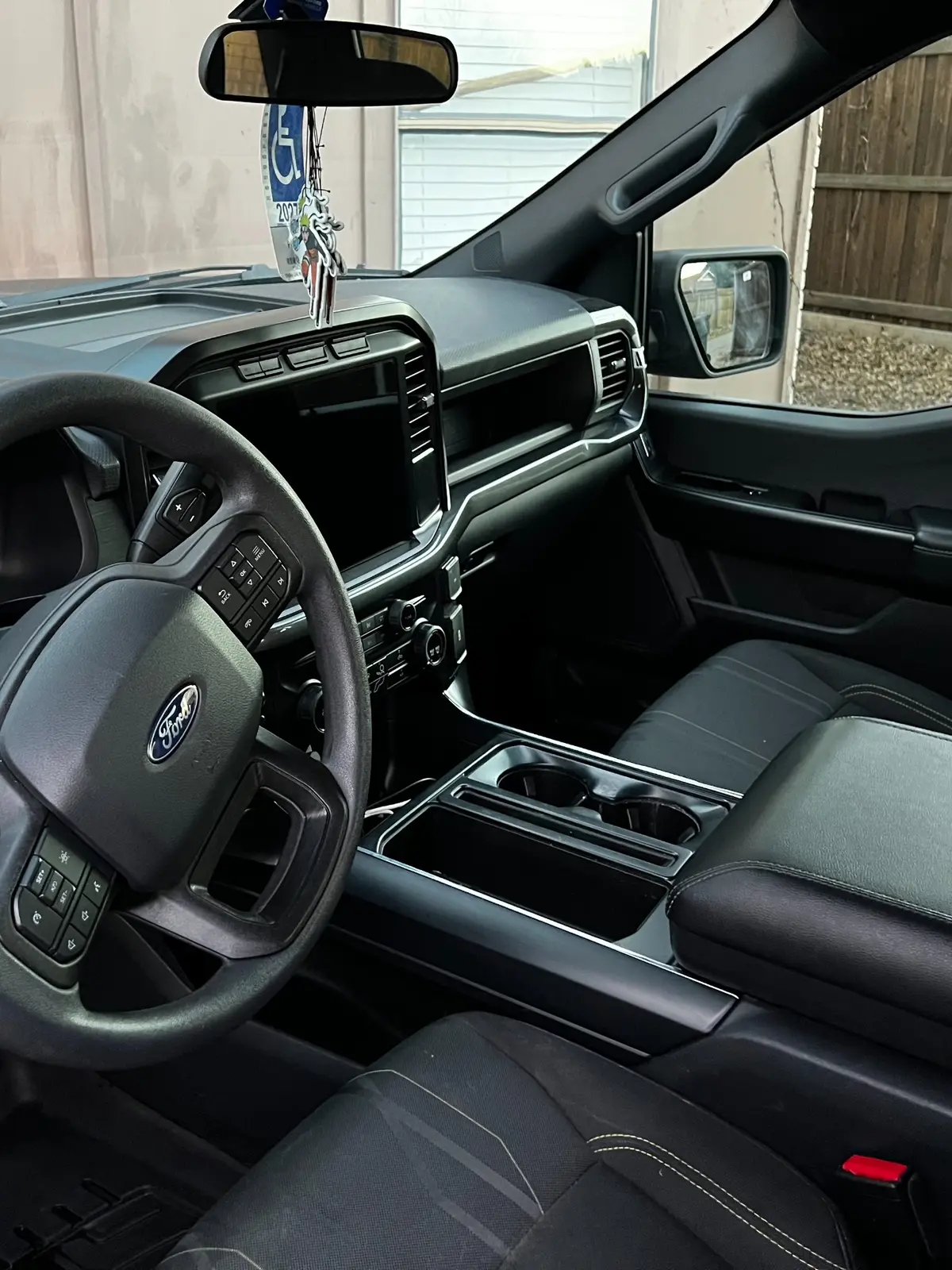 Clean front seats and center console of the Ford F-150 after detailing