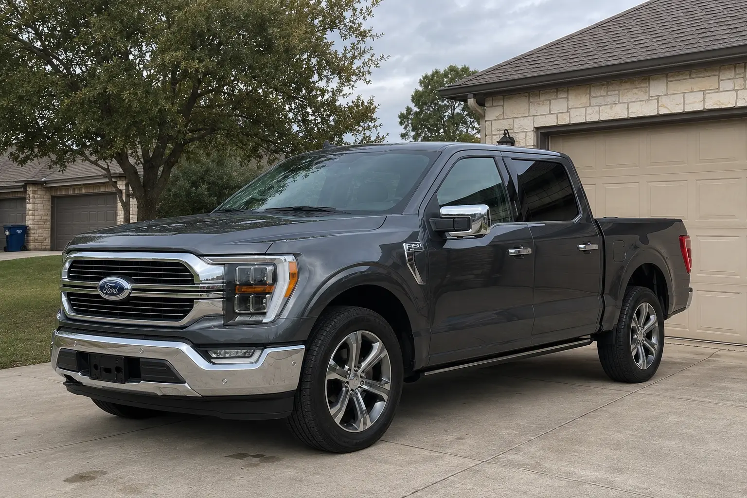 Detailed Ford F-150 in a home driveway on an overcast day