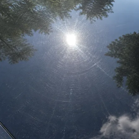 Untouched paint showing swirl marks and light scratches